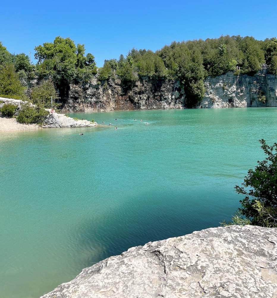 People swimming at the Elora Quarry Conservation Area 